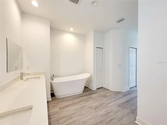 a bathroom with a bathtub sink and toilet