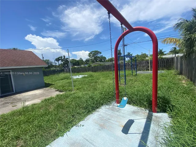 a view of a park with furniture