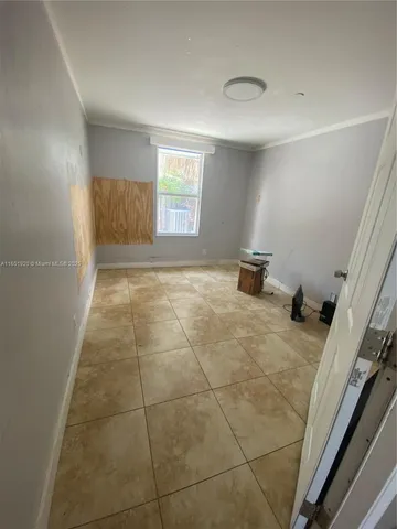 a view of an empty room and window