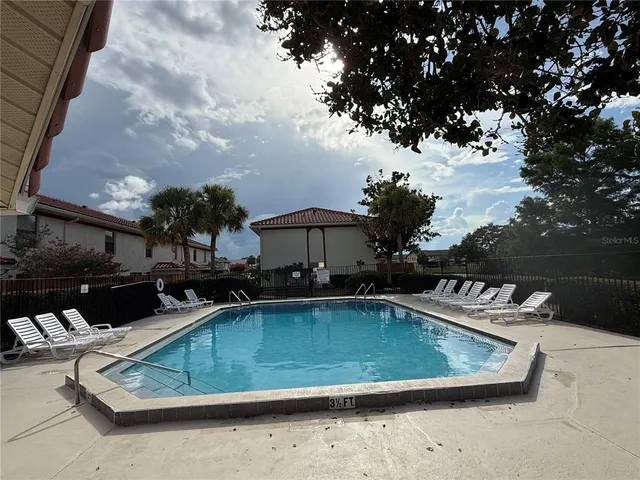 a view of a chairs and table in the patio