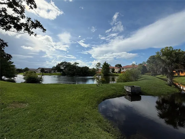 a view of a golf course with a lake