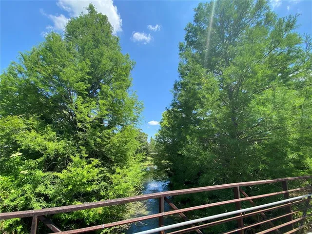 a view of house with tree in the background