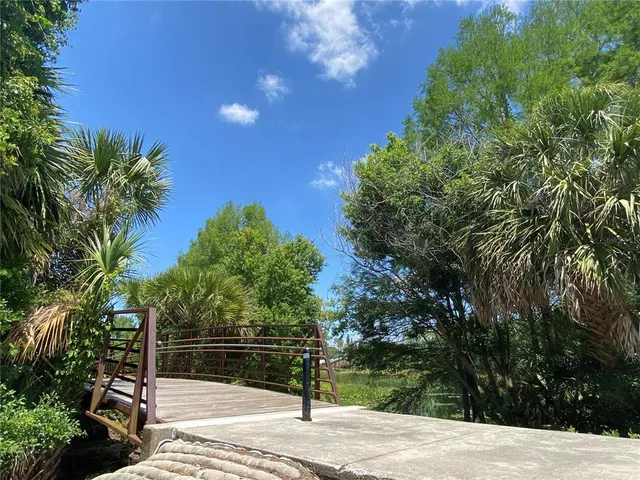 a view of a backyard with sitting area