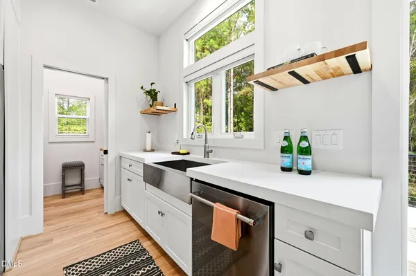 a bedroom with a bed and a sink