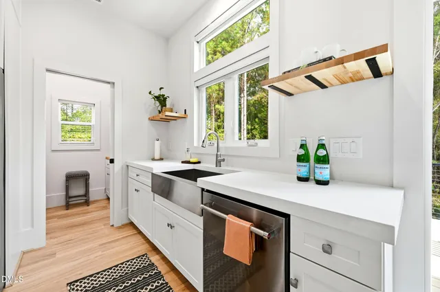 a bedroom with a bed and a sink