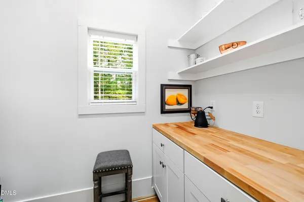 a bedroom with bed and a window