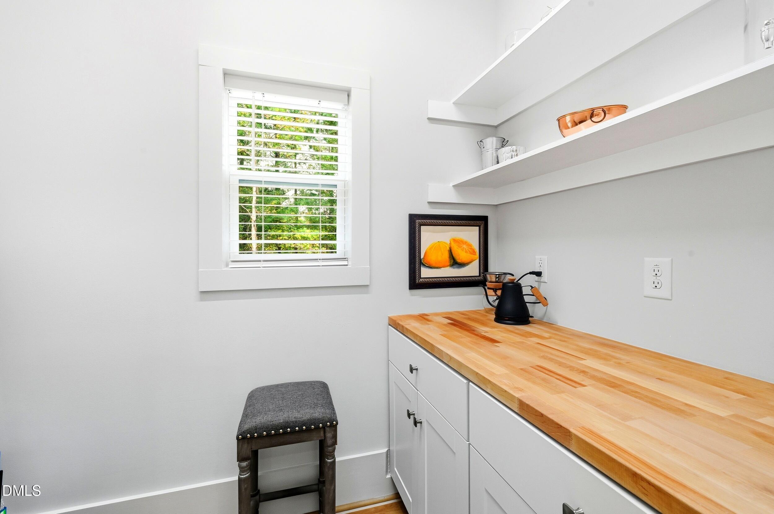 1459 Hawkins Road Hurdle Mills, NC 27541 - Photo 13 of 36 a bedroom with a bed and a sink