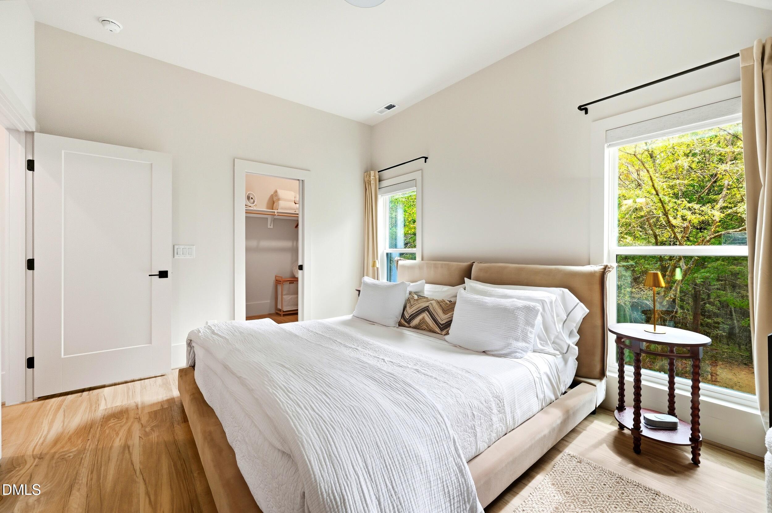 1459 Hawkins Road Hurdle Mills, NC 27541 - Photo 15 of 36 a bedroom with a bed and a large window