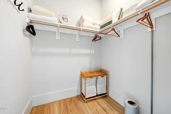 a bathroom with a sink and mirror with toilet