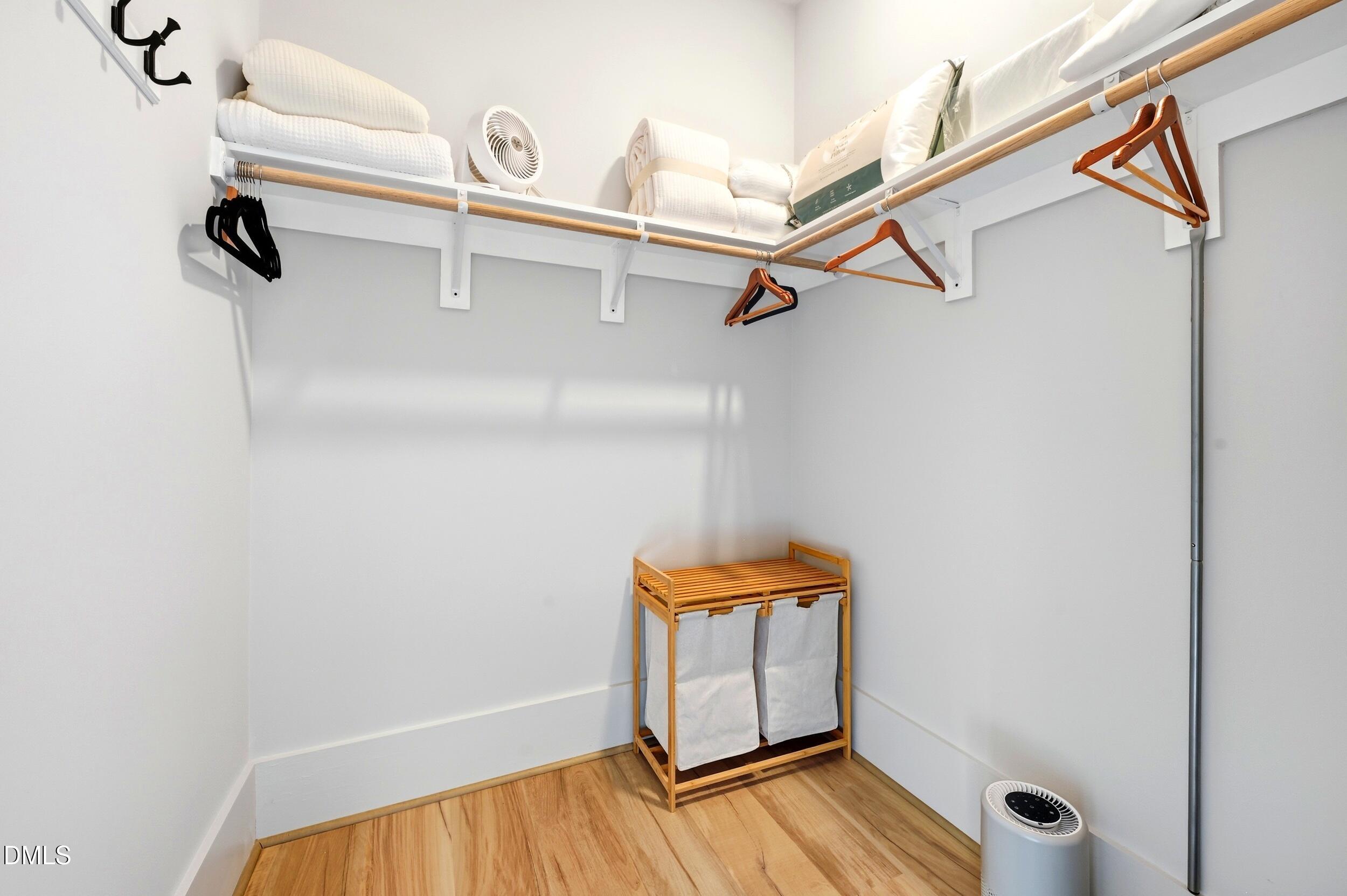 1459 Hawkins Road Hurdle Mills, NC 27541 - Photo 17 of 36 a view of walk in closet with clothes and shoes