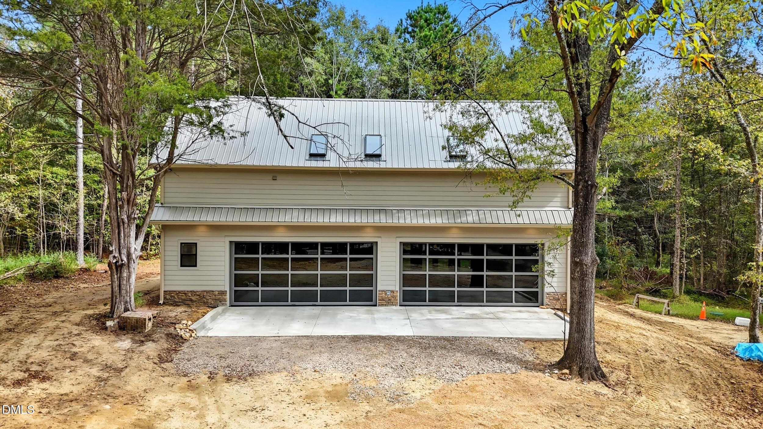 1459 Hawkins Road Hurdle Mills, NC 27541 - Photo 2 of 36 a front view of a house with a yard and garage
