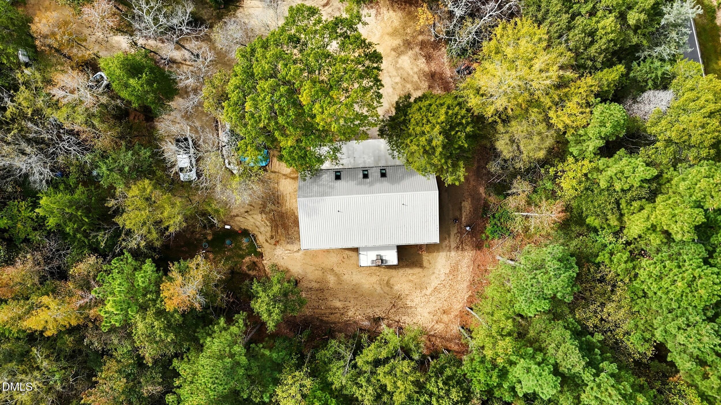 1459 Hawkins Road Hurdle Mills, NC 27541 - Photo 31 of 36 a house view with a trees in front of it