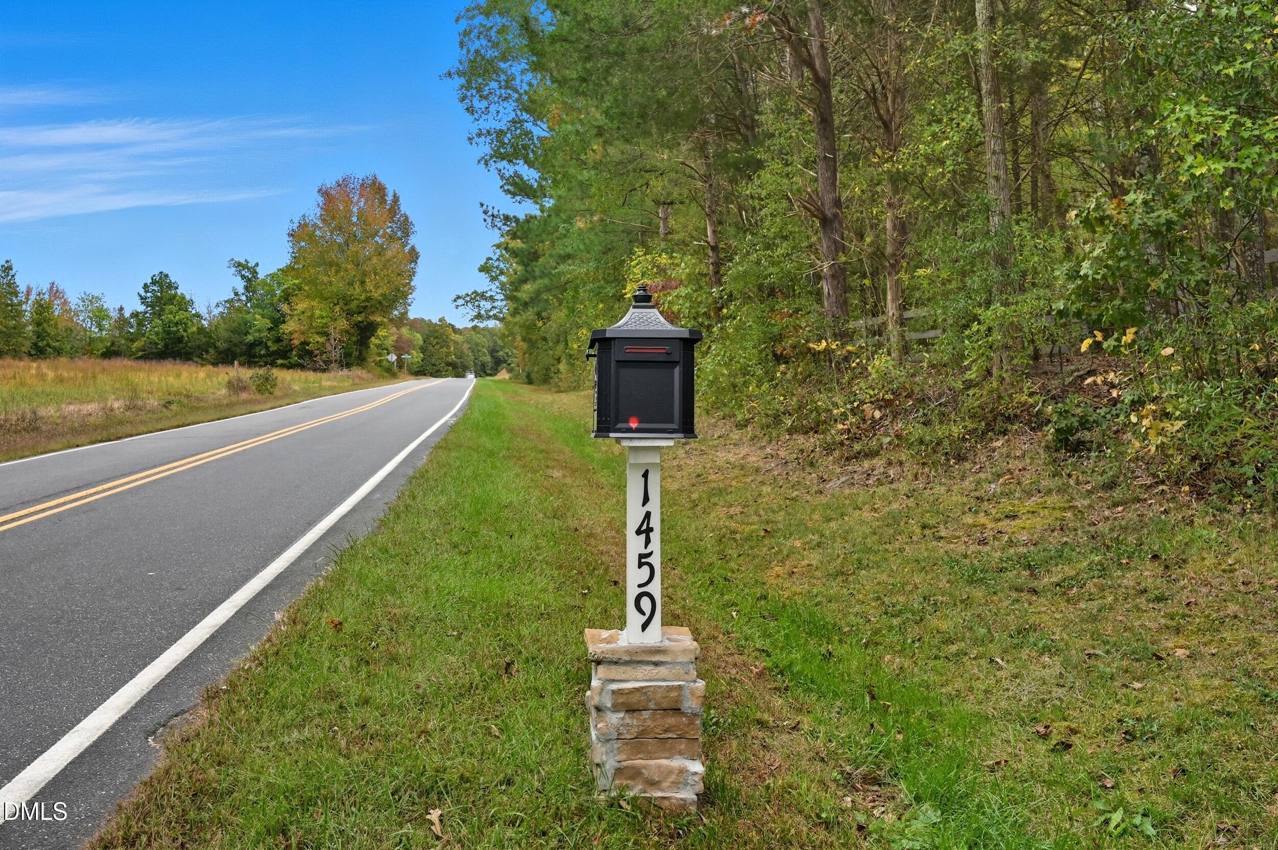 1459 Hawkins Road Hurdle Mills, NC 27541 - Photo 36 of 36 a front view of a house with a yard
