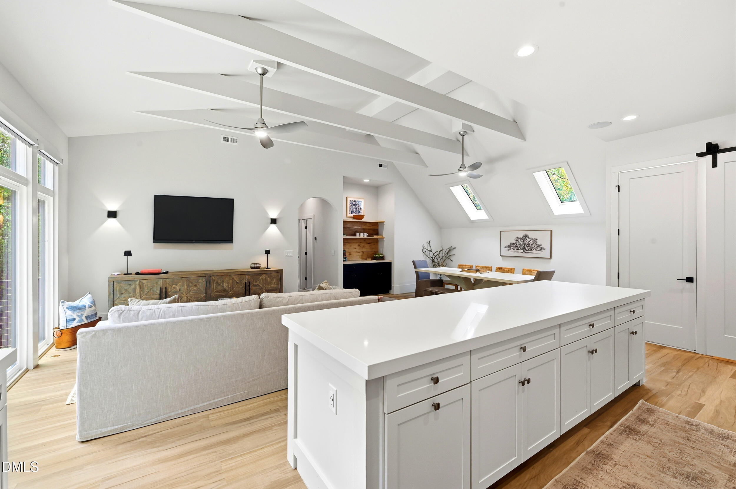 1459 Hawkins Road Hurdle Mills, NC 27541 - Photo 10 of 36 a large white kitchen with a large counter top a refrigerator and a couch