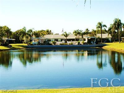 6916 Winkler Road Fort Myers, FL 33919 - Photo 8 of 10 a view of a lake with houses