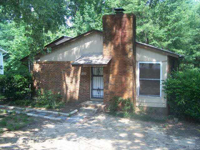 2717 Wyncote Drive Raleigh, NC 27603 - Photo 1 of 9 a front view of a house with a yard and potted plants