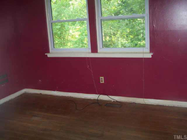 2717 Wyncote Drive Raleigh, NC 27603 - Photo 5 of 9 a view of a small space with wooden floor and a window