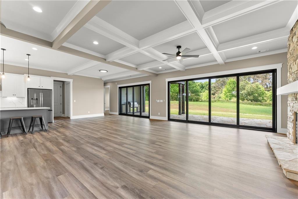 2275 Dr Bramblett Road Cumming, GA 30028 - Photo 11 of 78 a view of an empty room with window and wooden floor