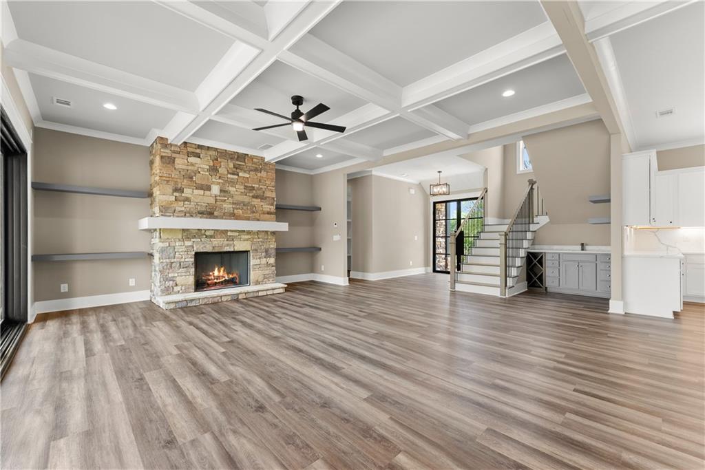 2275 Dr Bramblett Road Cumming, GA 30028 - Photo 13 of 78 a view of empty room with wooden floor and fireplace