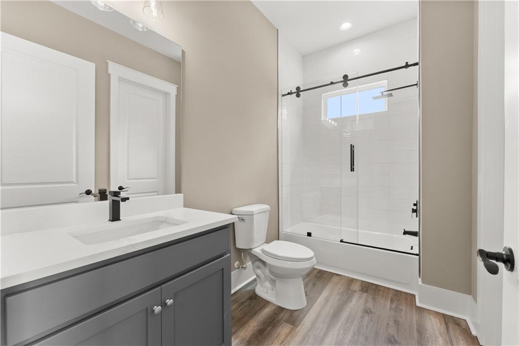 2275 Dr Bramblett Road Cumming, GA 30028 - Photo 30 of 78 a bathroom with a sink a toilet and shower