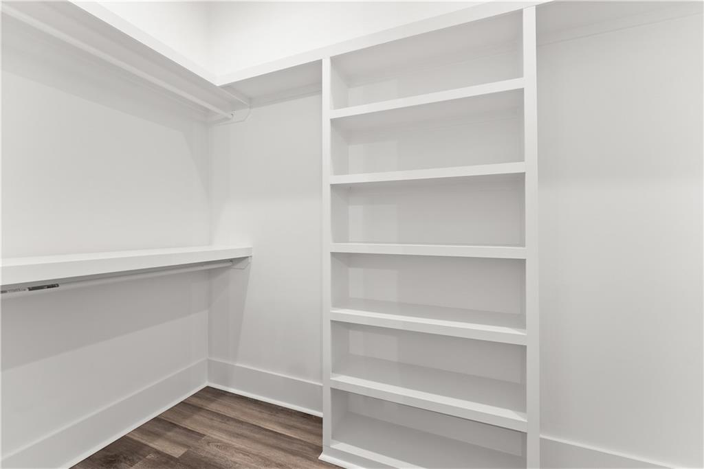 2275 Dr Bramblett Road Cumming, GA 30028 - Photo 31 of 78 a view of walk in closet with empty racks