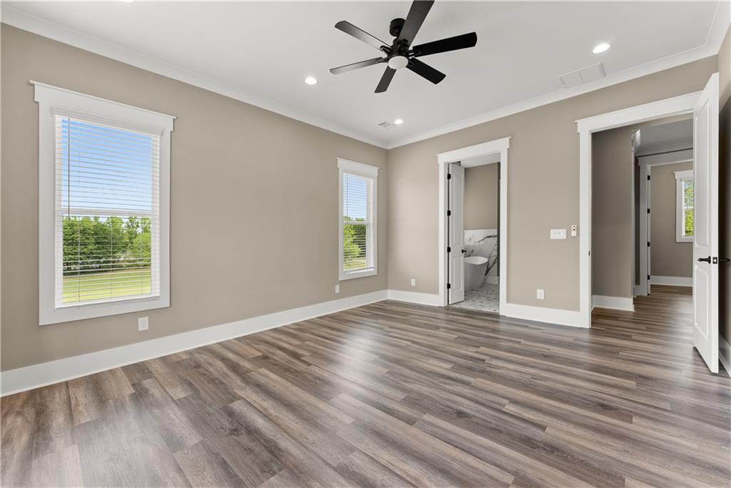 2275 Dr Bramblett Road Cumming, GA 30028 - Photo 35 of 78 a view of an empty room with window and wooden floor