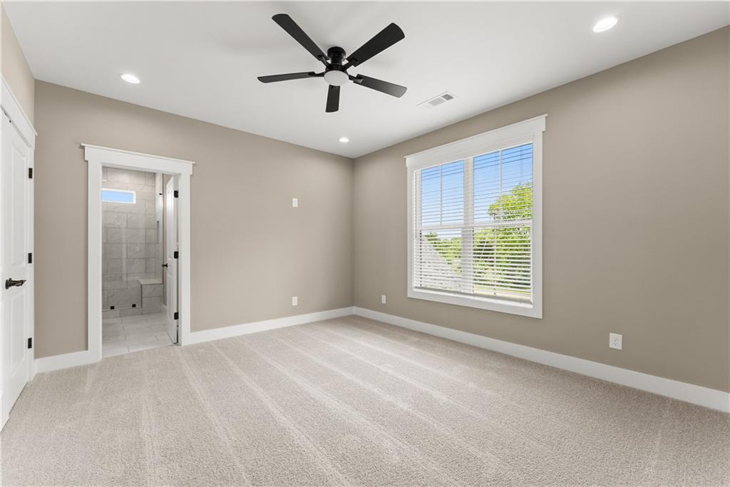 2275 Dr Bramblett Road Cumming, GA 30028 - Photo 45 of 78 a view of a livingroom with a ceiling fan and window