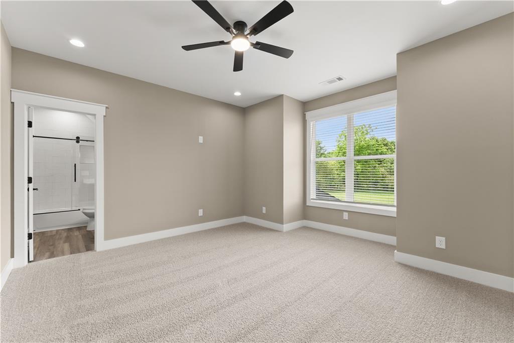2275 Dr Bramblett Road Cumming, GA 30028 - Photo 49 of 78 an empty room with fan and windows