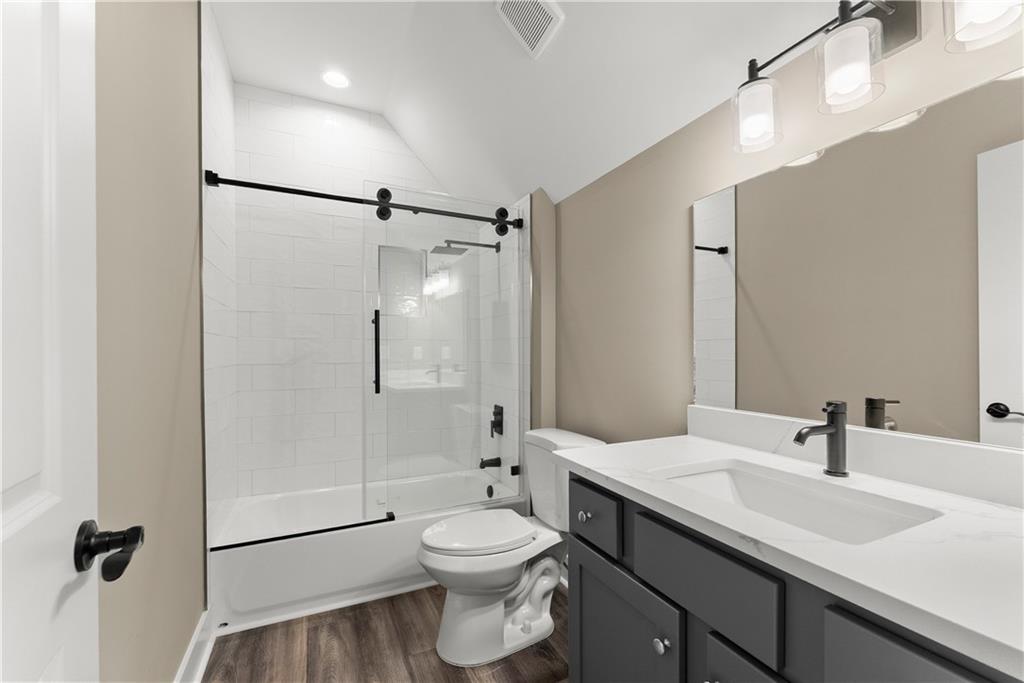 2275 Dr Bramblett Road Cumming, GA 30028 - Photo 51 of 78 a bathroom with a sink a toilet and shower