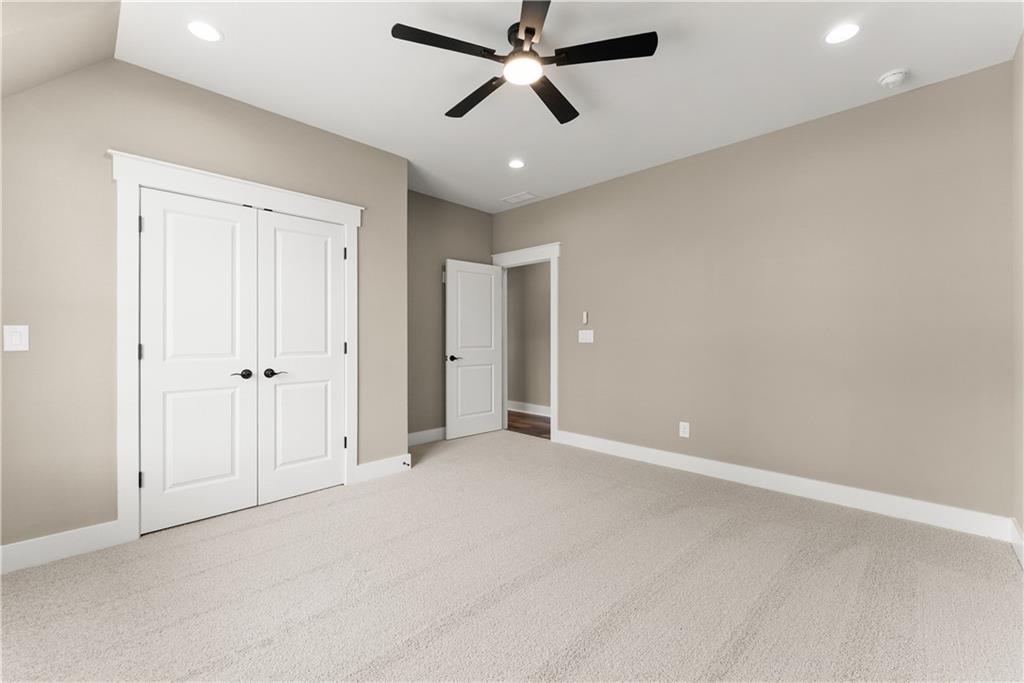 2275 Dr Bramblett Road Cumming, GA 30028 - Photo 54 of 78 an empty room with closet and a ceiling fan
