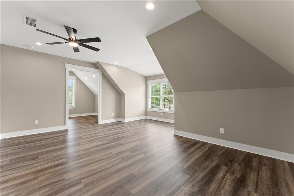 2275 Dr Bramblett Road Cumming, GA 30028 - Photo 55 of 78 wooden floor in an empty room with a window