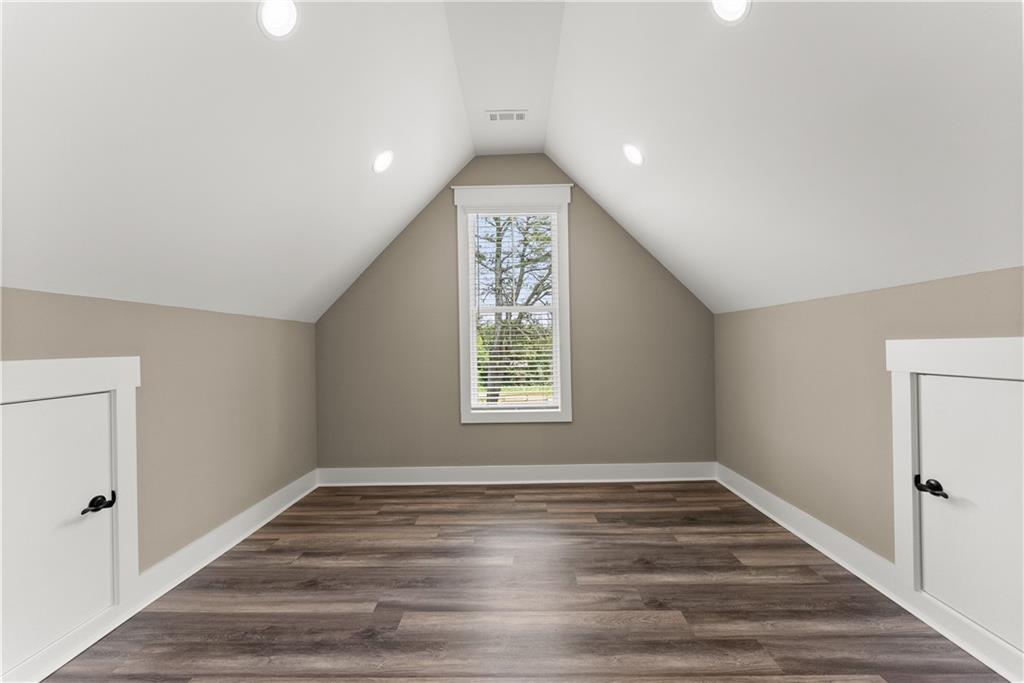 2275 Dr Bramblett Road Cumming, GA 30028 - Photo 58 of 78 a view of an empty room window and wooden floor