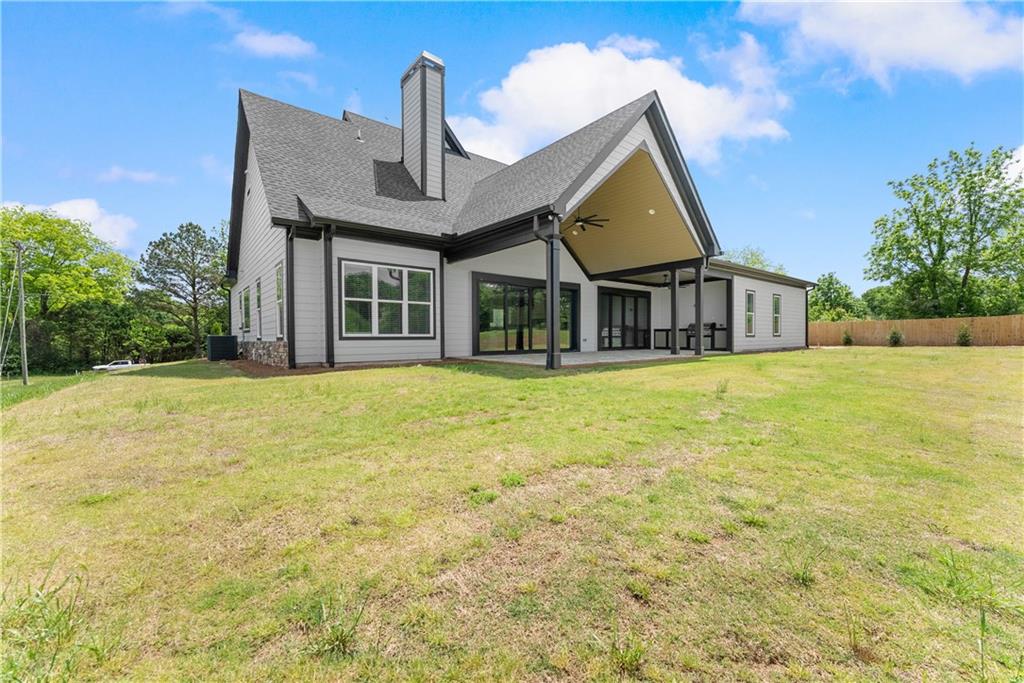 2275 Dr Bramblett Road Cumming, GA 30028 - Photo 66 of 78 a front view of house with yard and trees around