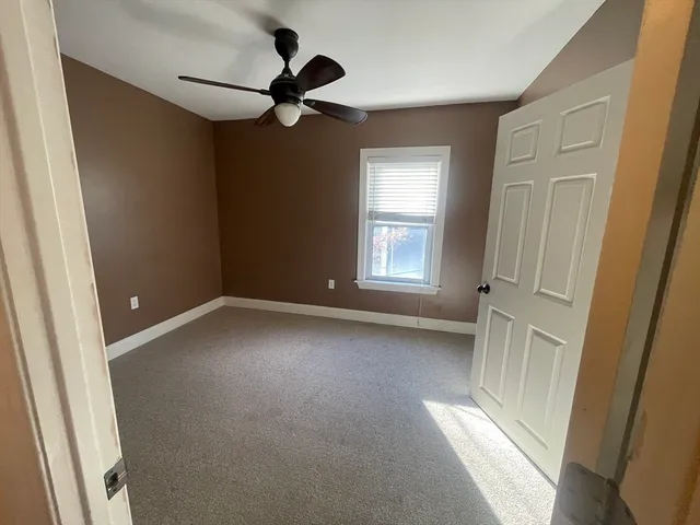 a view of empty room with windows