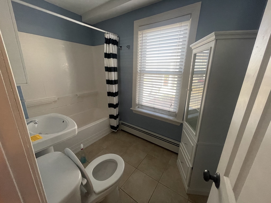 363 Shrewsbury Street, Unit 2 Worcester, MA 01604 - Photo 16 of 20 a bathroom with a tub a sink and a shower