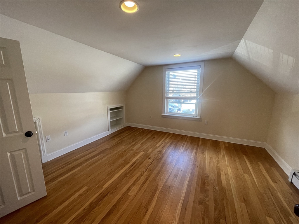 363 Shrewsbury Street, Unit 2 Worcester, MA 01604 - Photo 7 of 20 wooden floor in an empty room with a window