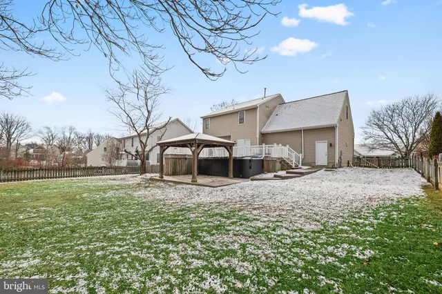 a tree in the middle of a yard