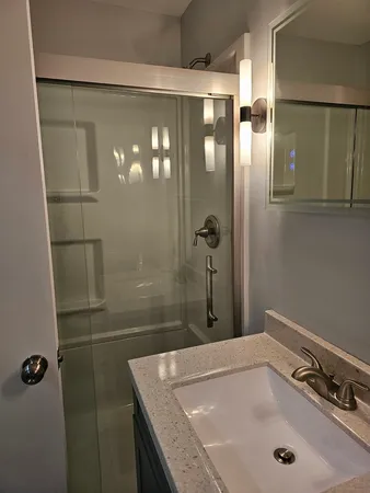 a bathroom with a tub and a shower