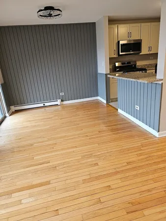 a view of kitchen with microwave and cabinets