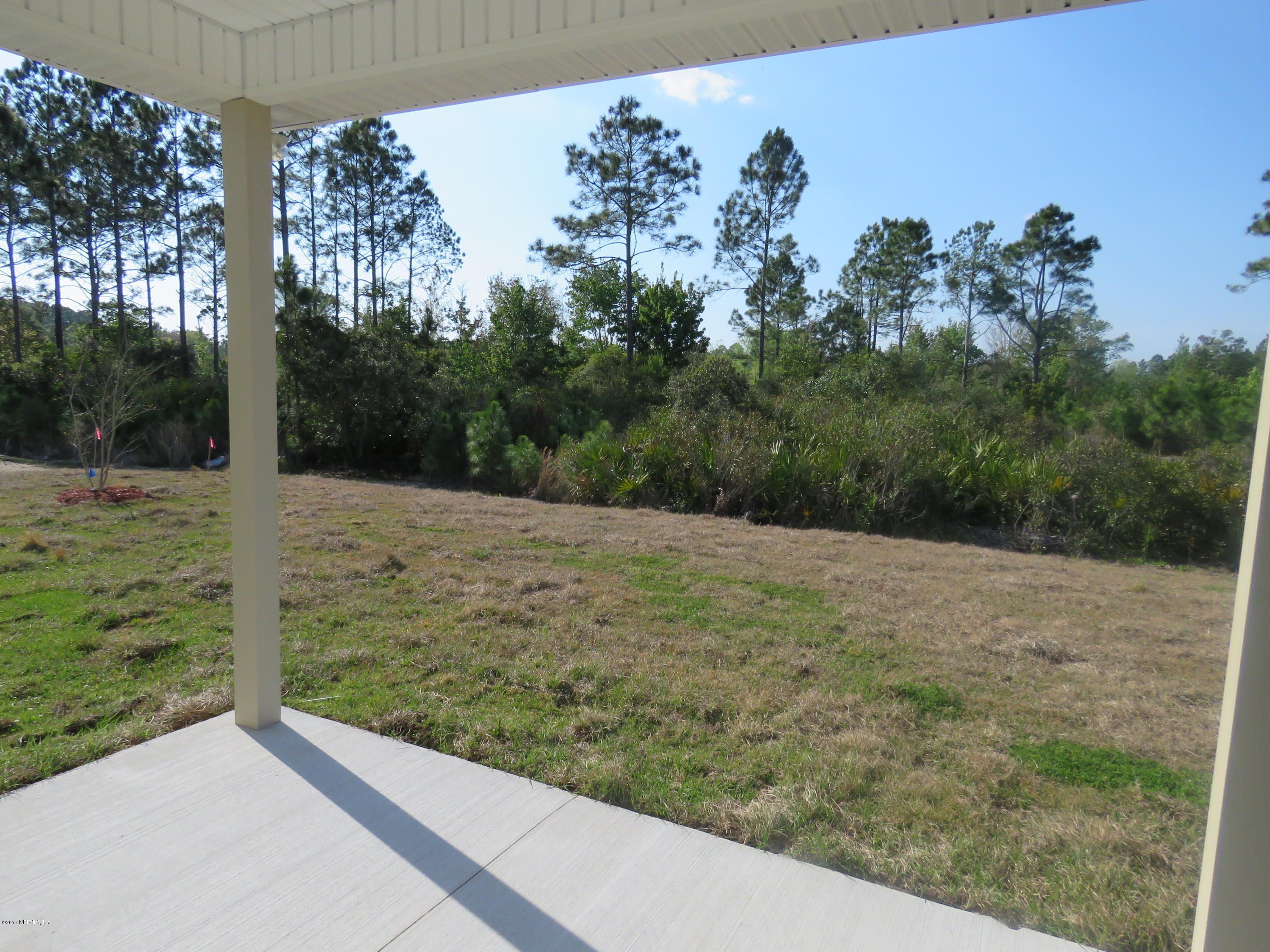 607 Deer Crossing Road St. Augustine, FL 32086 - Photo 12 of 28 a view of a yard with a tree
