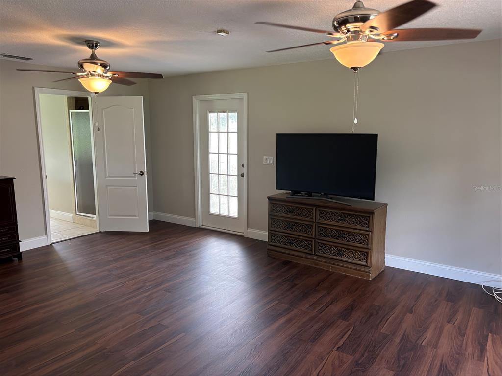 4641 Highway 98 Fort Meade, FL 33841 - Photo 12 of 14 wooden floor in an empty room with a window