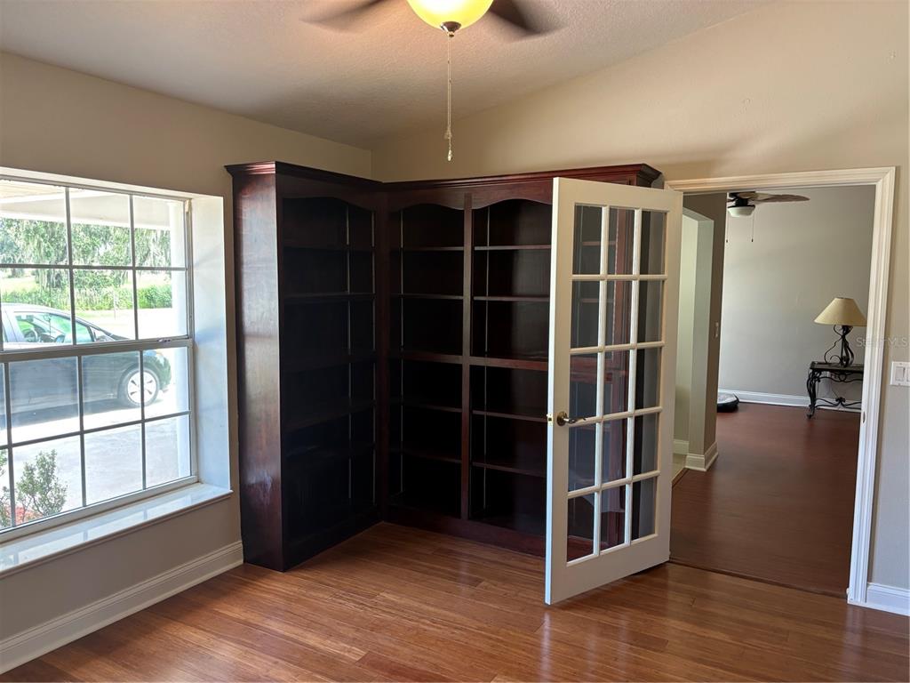 4641 Highway 98 Fort Meade, FL 33841 - Photo 4 of 14 a view of empty room with wooden floor and fan
