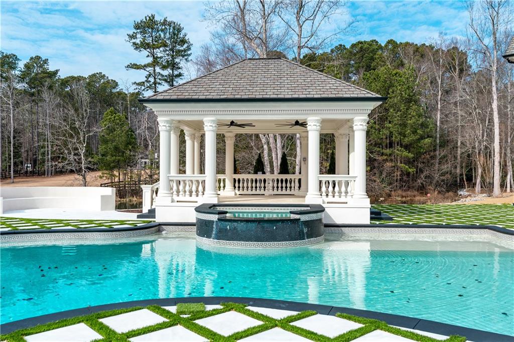 10450 Belladrum Alpharetta, GA 30022 - Photo 16 of 95 a view of a house with pool and sitting area