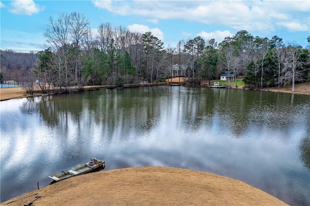 10450 Belladrum Alpharetta, GA 30022 - Photo 21 of 95 a view of a lake with a mountain in the background