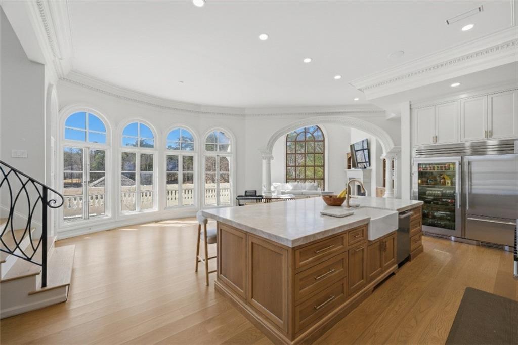 10450 Belladrum Alpharetta, GA 30022 - Photo 25 of 95 a large white kitchen with large windows and refrigerator