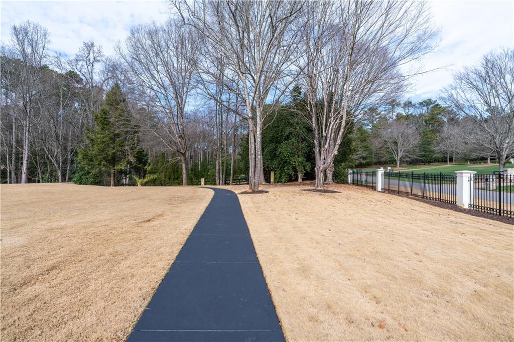 10450 Belladrum Alpharetta, GA 30022 - Photo 26 of 95 a view of swimming pool with trees in the background