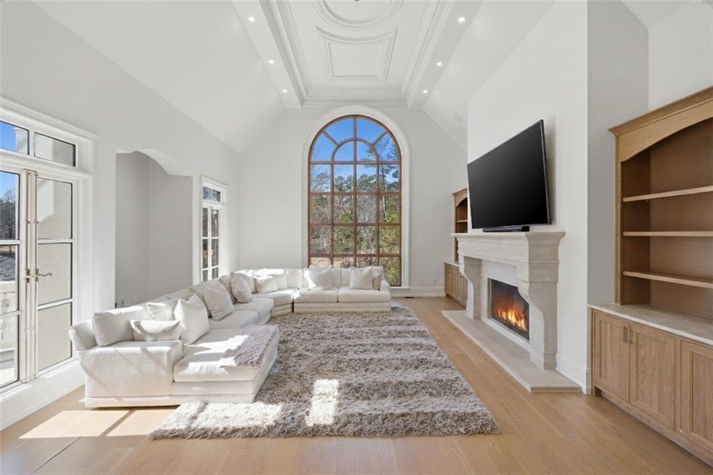 10450 Belladrum Alpharetta, GA 30022 - Photo 28 of 95 a living room with fireplace furniture and a flat screen tv