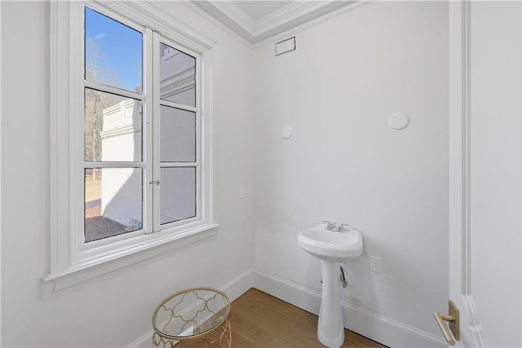 10450 Belladrum Alpharetta, GA 30022 - Photo 47 of 95 a bathroom with a sink a light fixture and a toilet