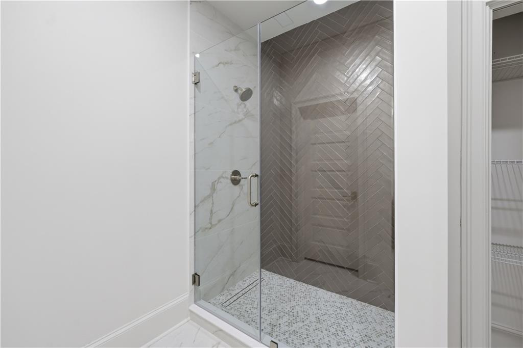 10450 Belladrum Alpharetta, GA 30022 - Photo 49 of 95 a bathroom with a glass shower door