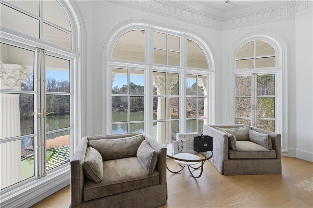 10450 Belladrum Alpharetta, GA 30022 - Photo 71 of 95 a living room with furniture and floor to ceiling windows